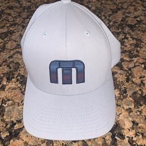 Grey Travis Matthew 110 FlexFit SnapBack with navy blue and red coloring on logo